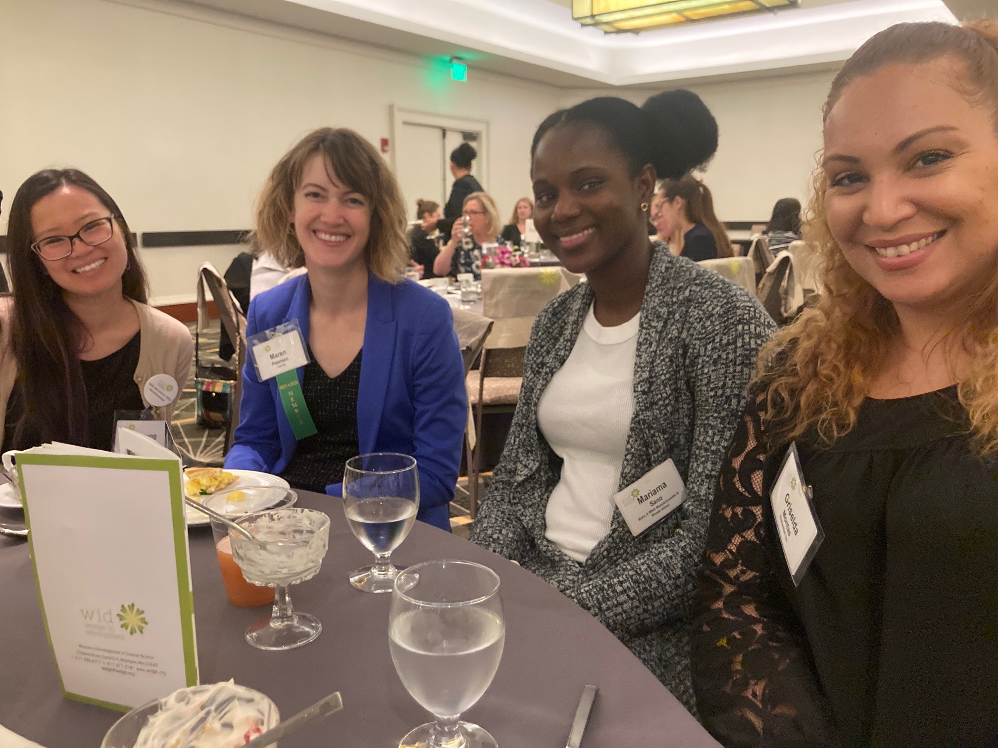 Four womean sitting together at a table