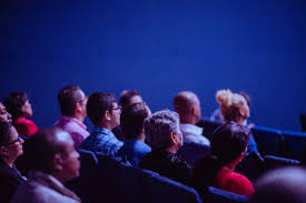 Image of people sitting in an auditorium