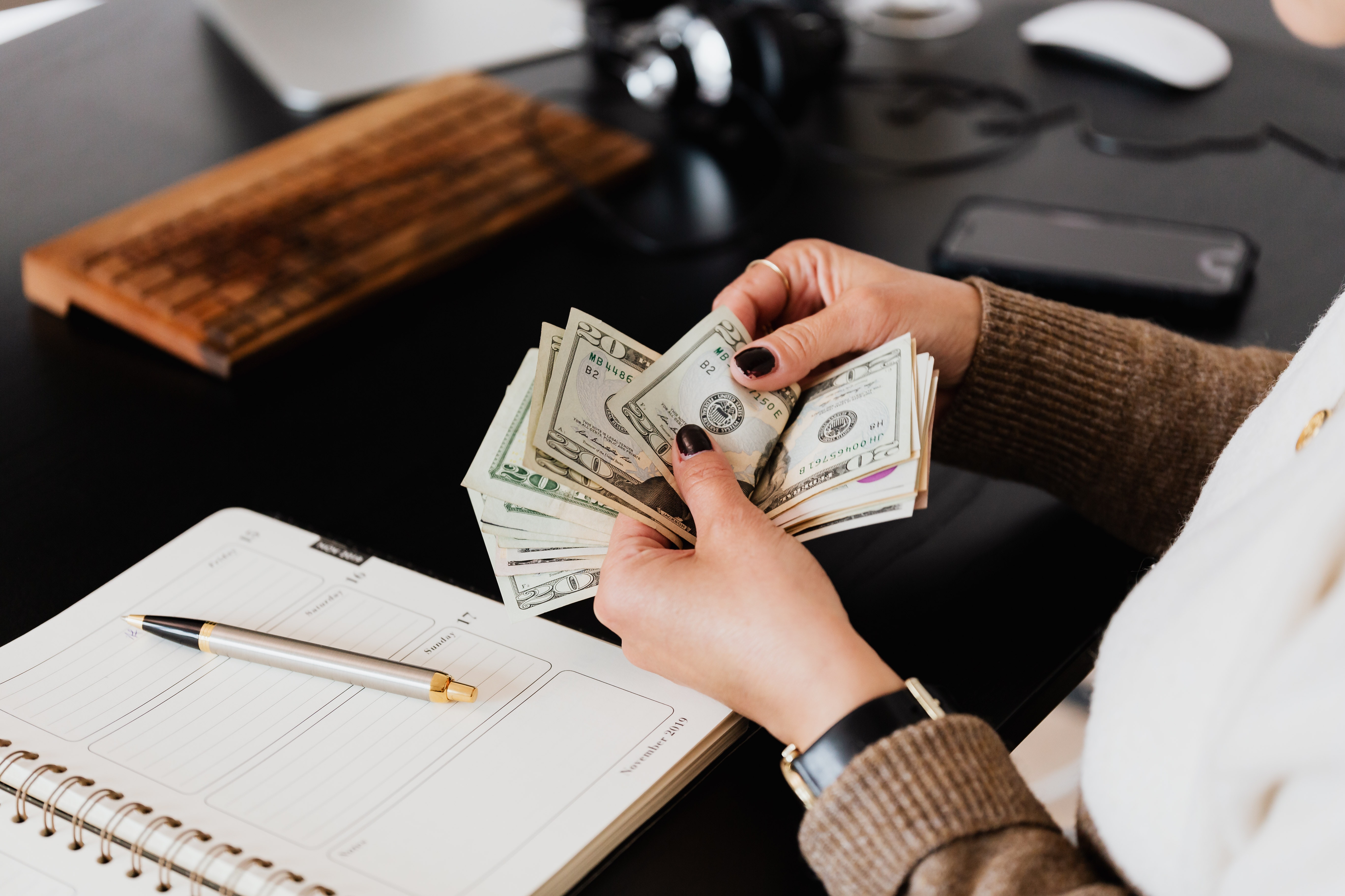 woman's hands counting cash